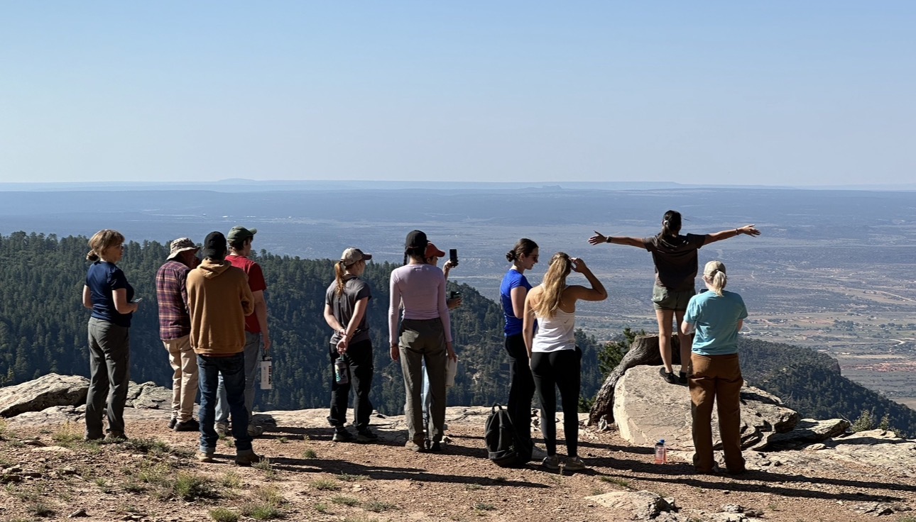 An educational group looking across the Navajo Nation landscape during a hosted visit.