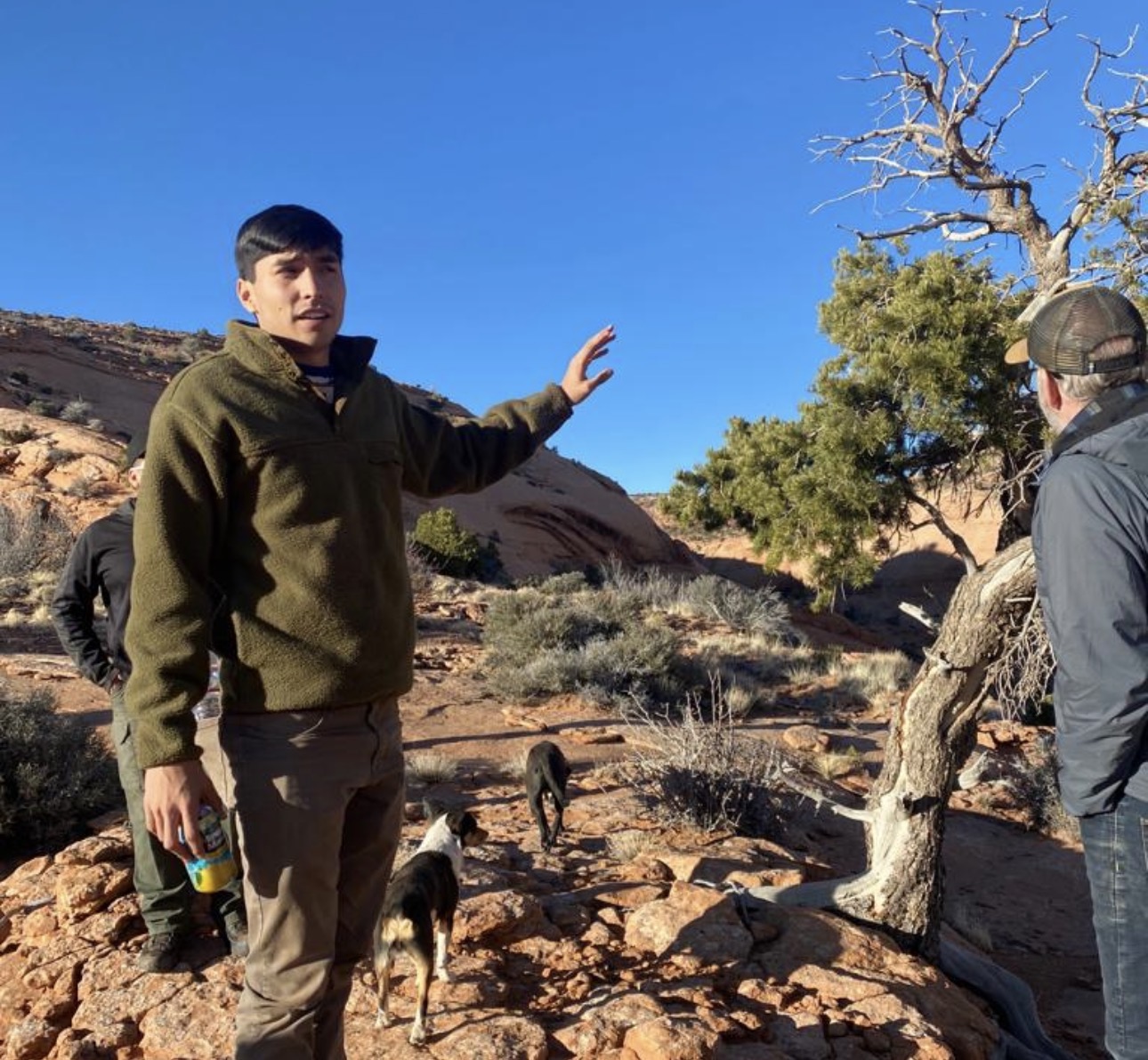 Tim Benally guiding visitors during a Navajo Sheepcamp experience.